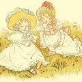 Two little girls sitting on the grass